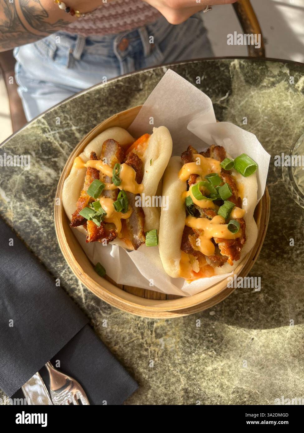 Delicious and soft bao buns with the perfect filling, served for lunch in Croatia. A flavorful and satisfying dish. - Smartphone Captured Stock Image