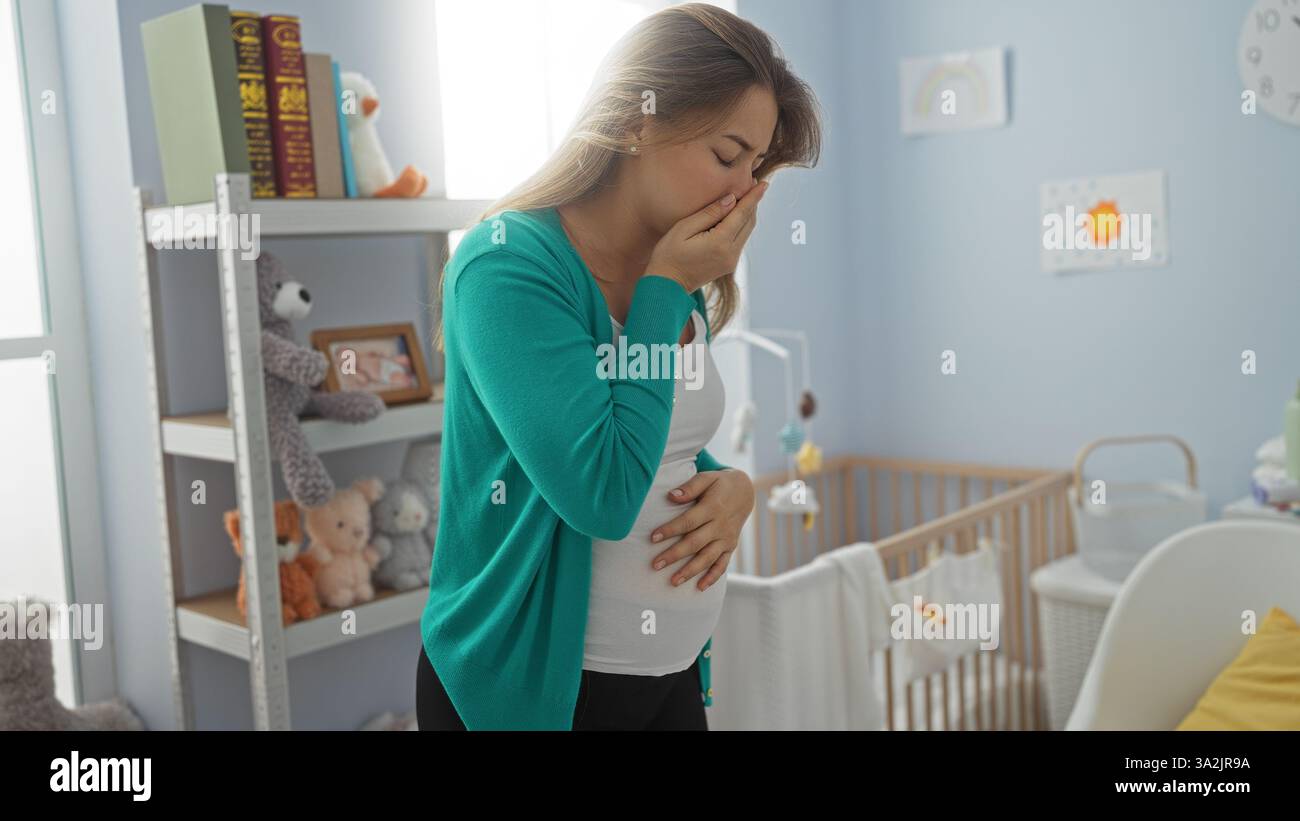 Pregnant woman feeling nauseous in a baby's nursery with toys and crib, expressing morning sickness surrounded by soft sunlight, implying early pregna Stock Photo