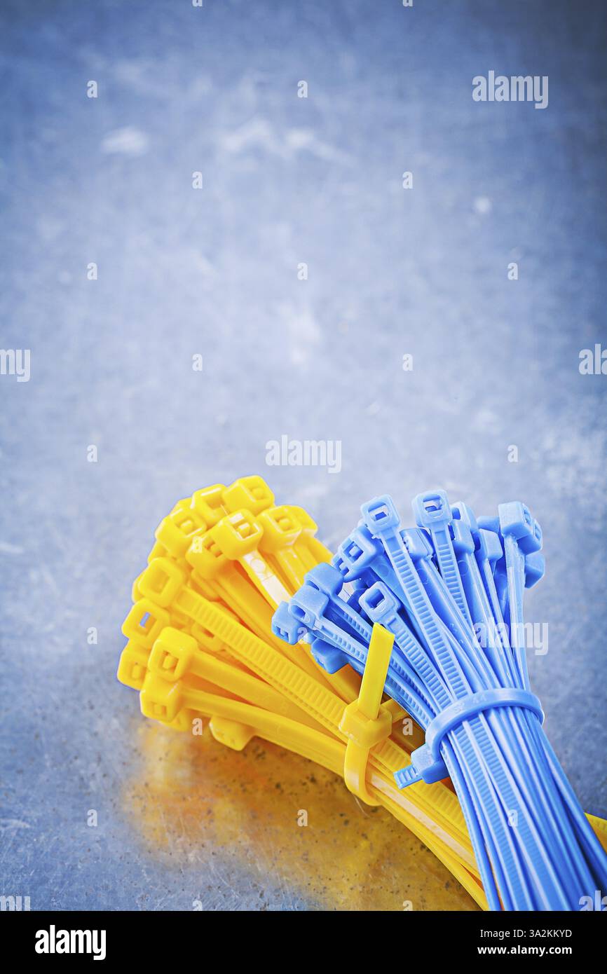 Set of self-locking cable ties on metallic background construction concept Stock Photo