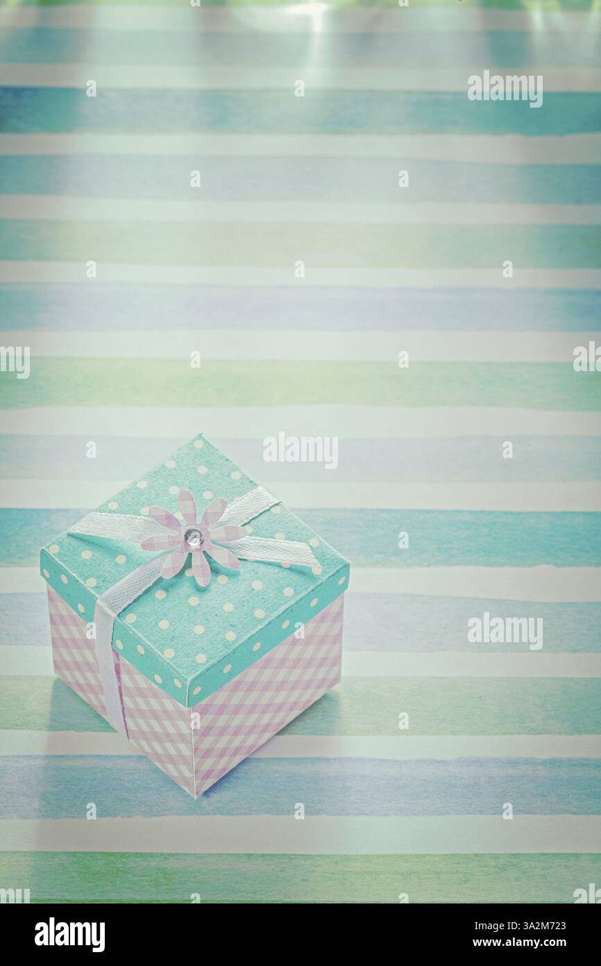 Vintage square gift box on colored background Stock Photo