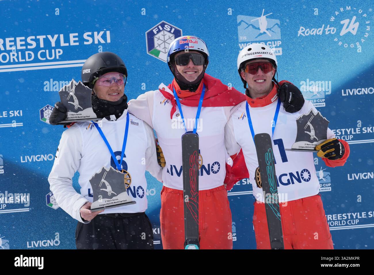 Switzerland's Noe Roth, centre, celebrates on the podium after winning ...