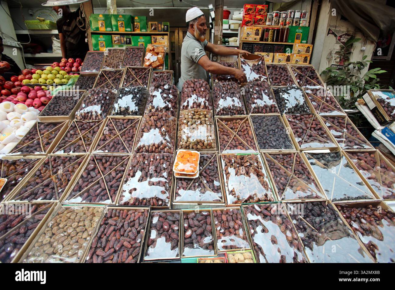 A Bangladeshi shopkeeper is displaying dates for sale, shopkeeper