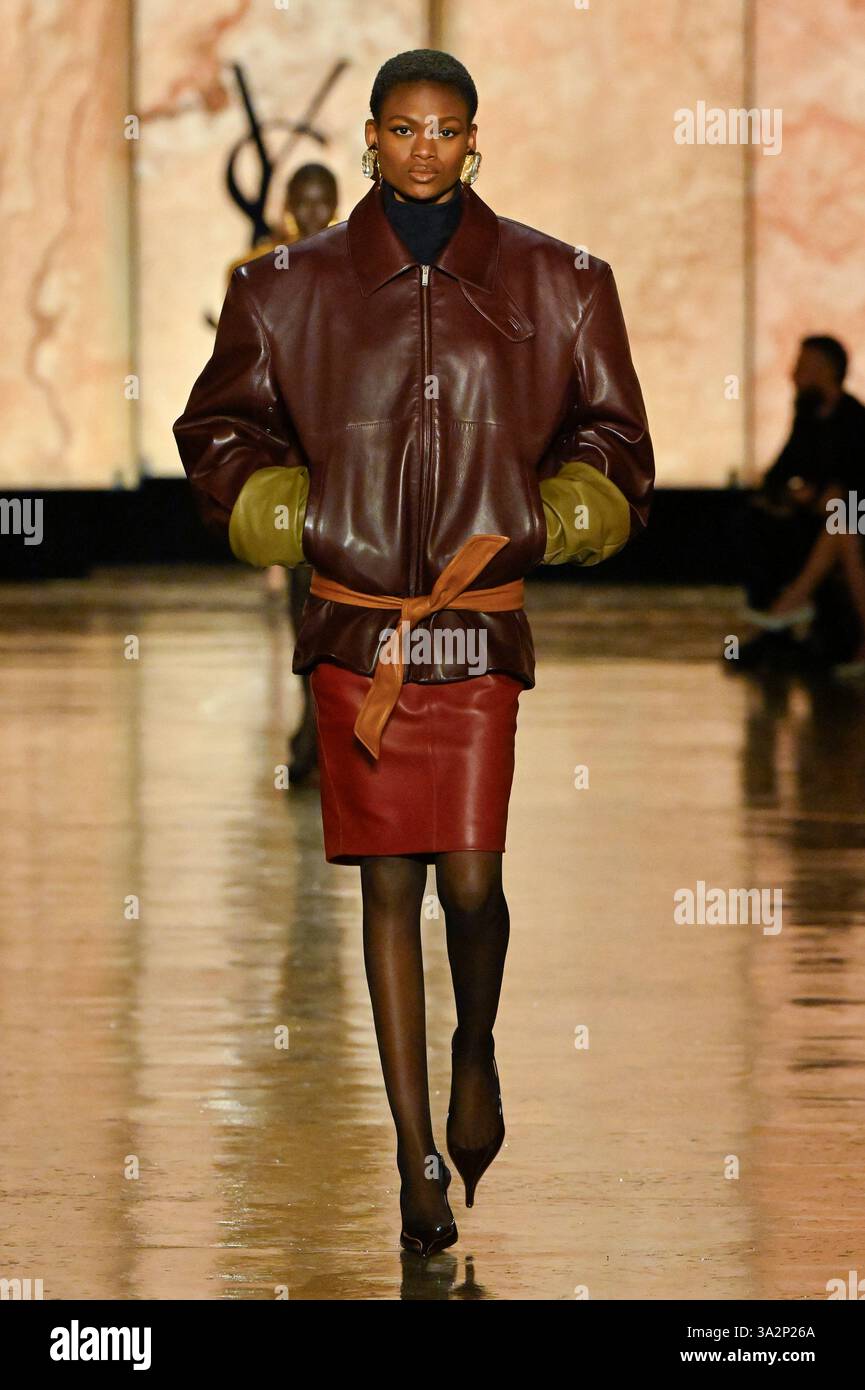 Model Micklate Macobola walks on the runway during the Saint Laurent ...
