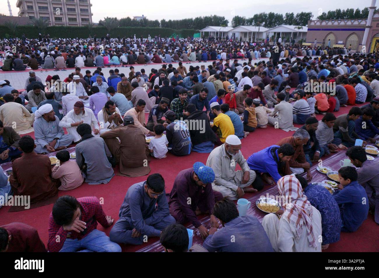 GUJRANWALA, PAKISTAN, MAR 13 Faithful Muslims are breaking the fast (Iftar) during the Holy