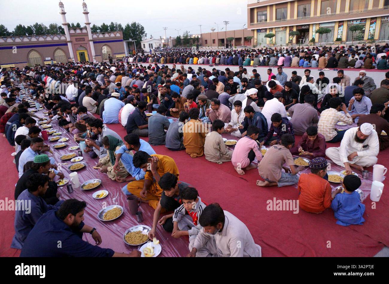 GUJRANWALA, PAKISTAN, MAR 13 Faithful Muslims are breaking the fast (Iftar) during the Holy