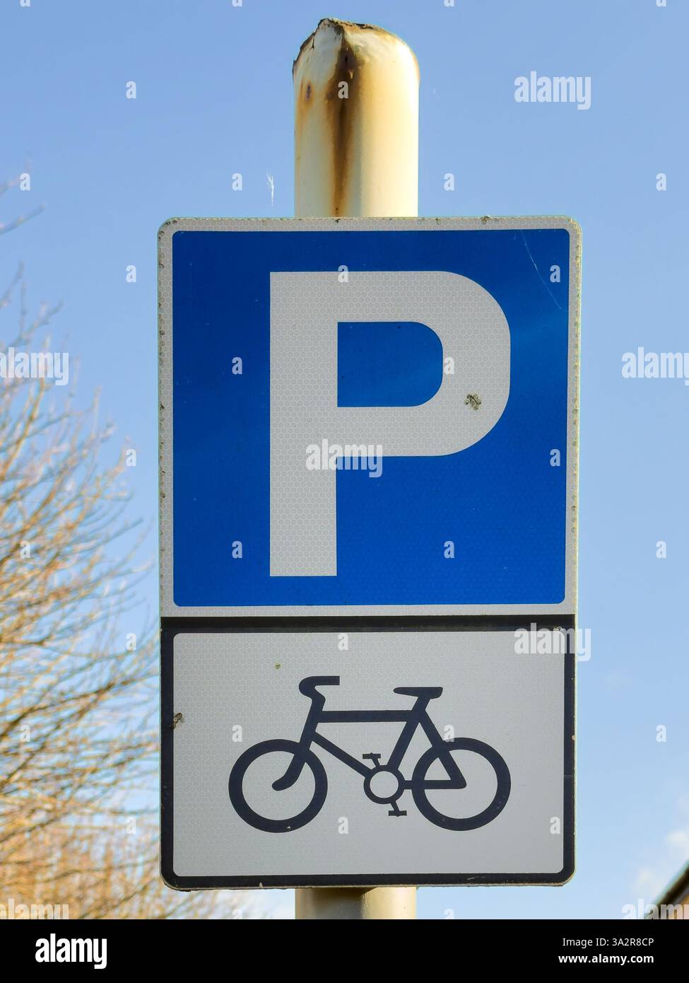 A UK parking and cycle sign against blue sky - Smartphone Captured Stock Image