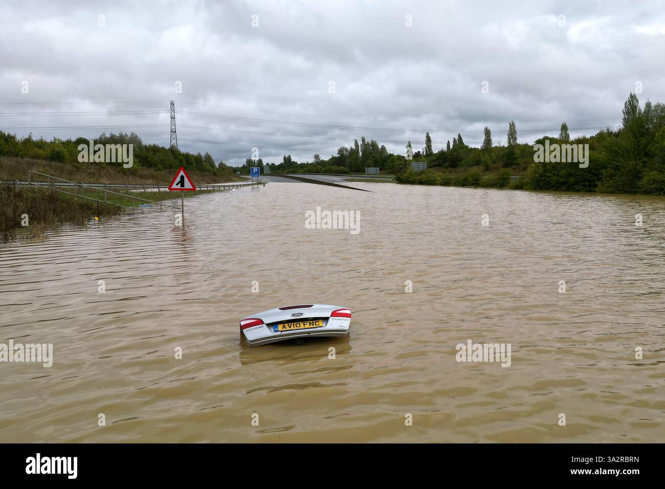 the-open-boot-of-a-car-is-visible-above-the-water-where-the-vehicle-is