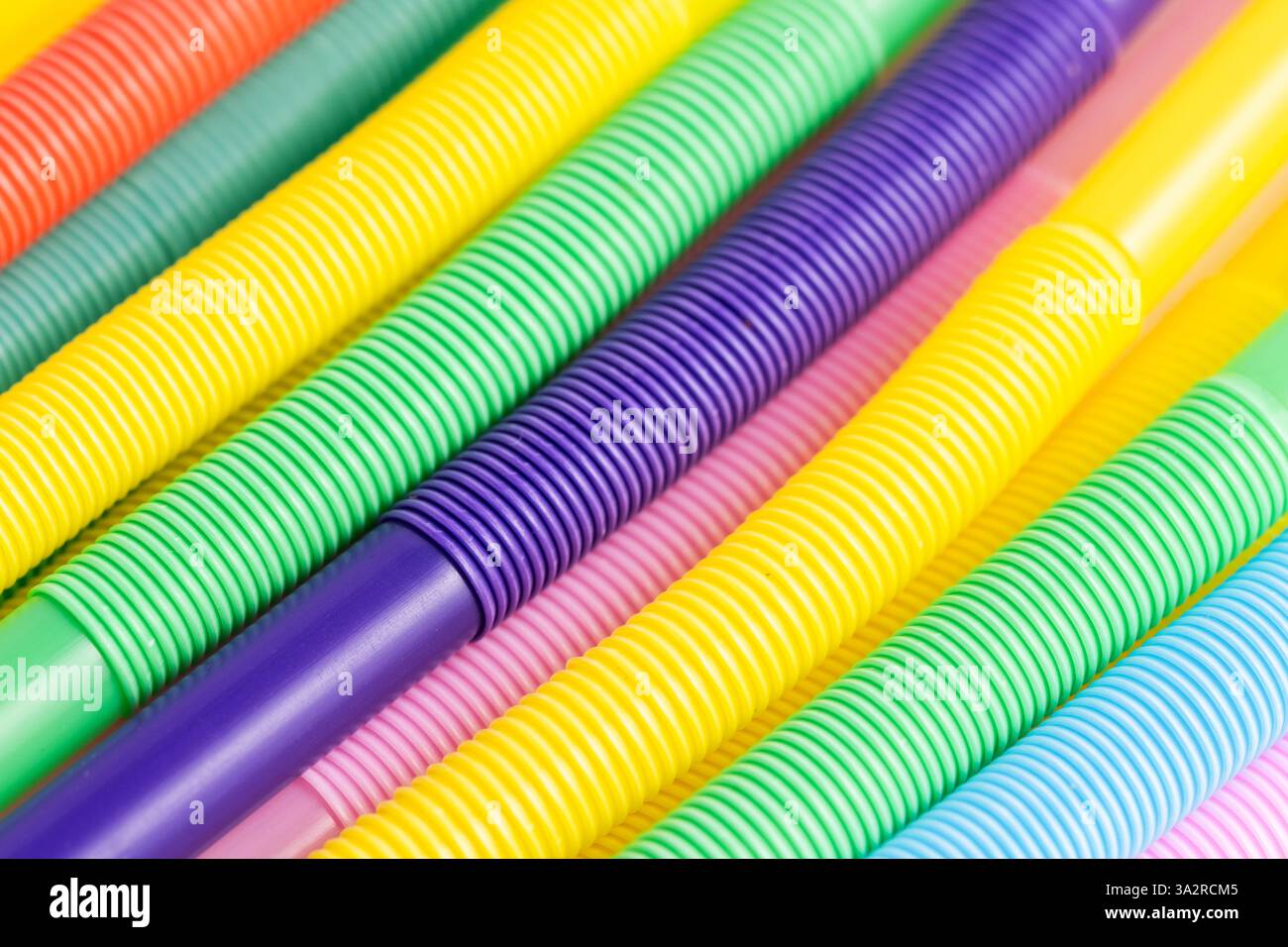 Colorful plastic drinking straws, closeup. Background Stock Photo