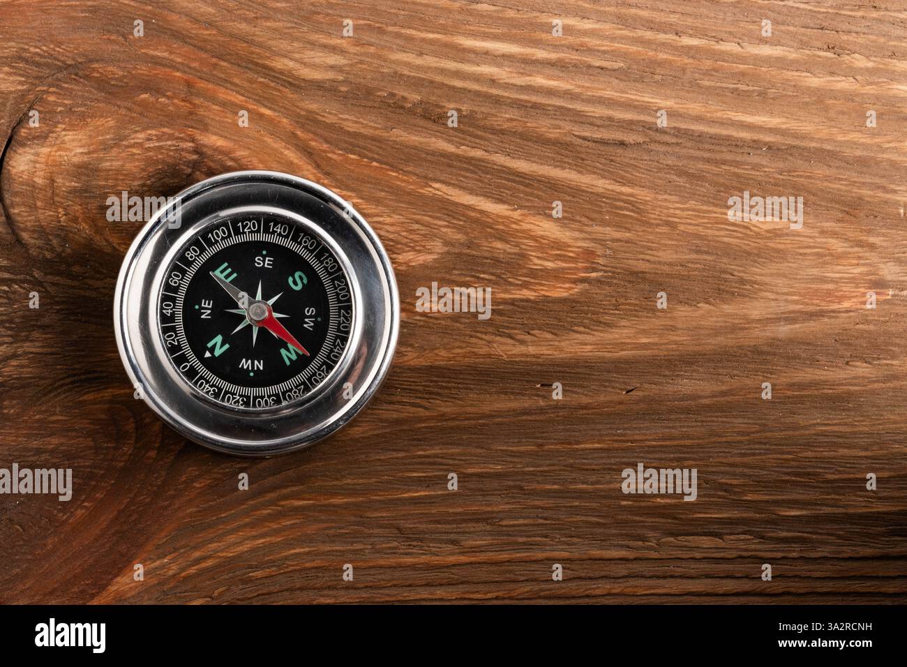 Compass on wooden background with copy space for your text Stock Photo