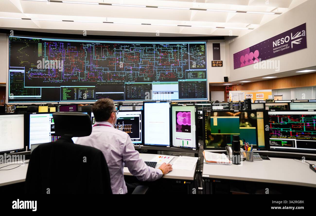 A worker in the National Grid control room in Sindlesham, Berkshire as ...