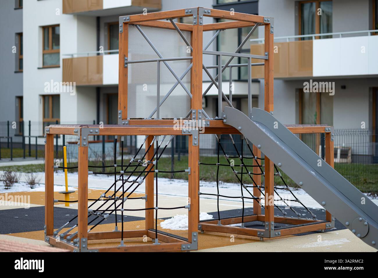Modern playground of children with wooden climbing frames, rope nets ...
