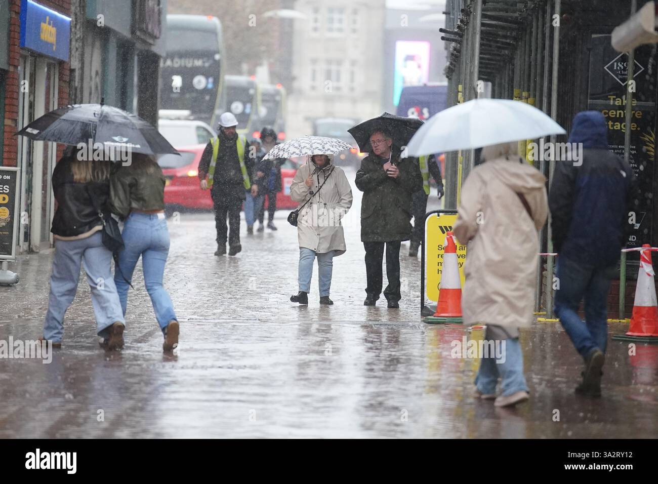 People walking in the rain in Blackpool. Temperatures could hit 20C in ...