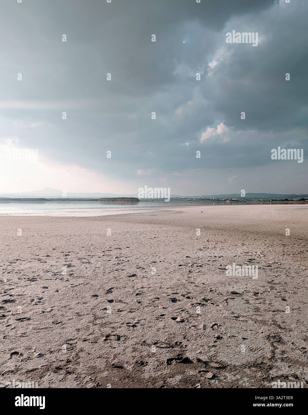 Larnaca Salt Lake under moody skies, capturing the quiet beauty of Cyprus' natural landscape. - Smartphone Captured Stock Image
