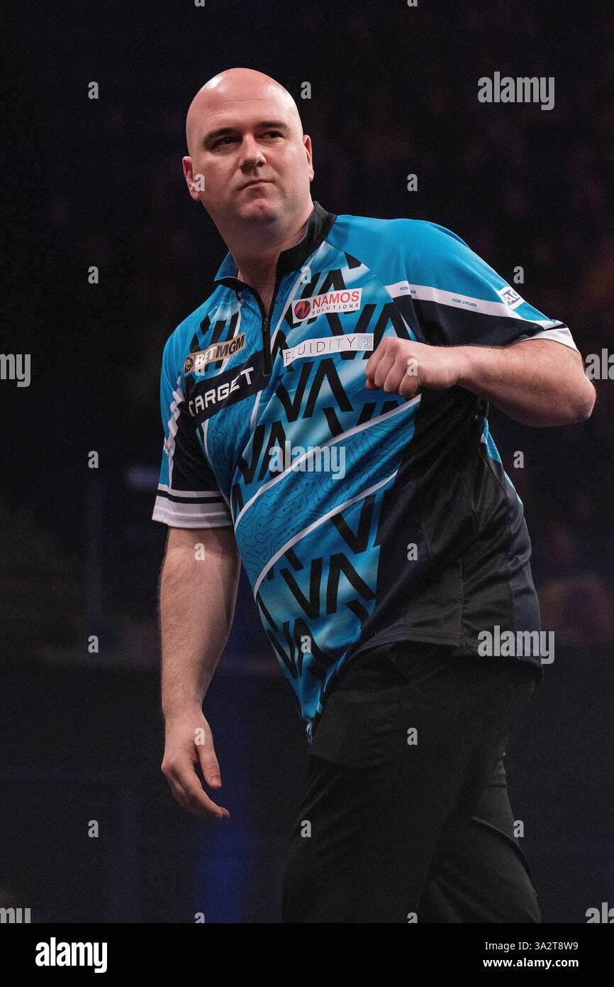 Rob Legs Rob Cross celebrates winning a leg against Luke Littler during the ...