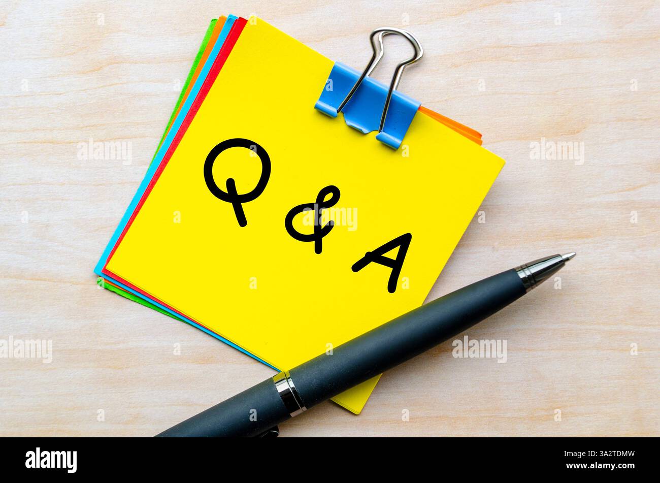 Q and A text on yellow notepad. Question and Answer concept. Stock Photo