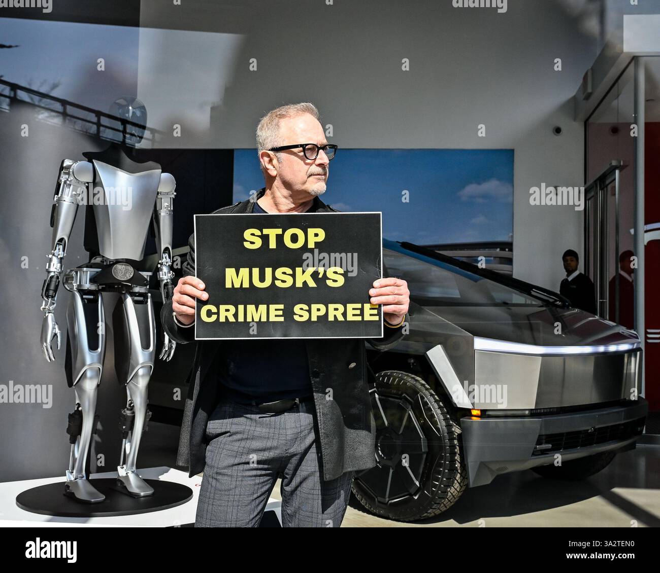 Activists with the nonviolent political action group Rise & Resist protest Elon Musk at the