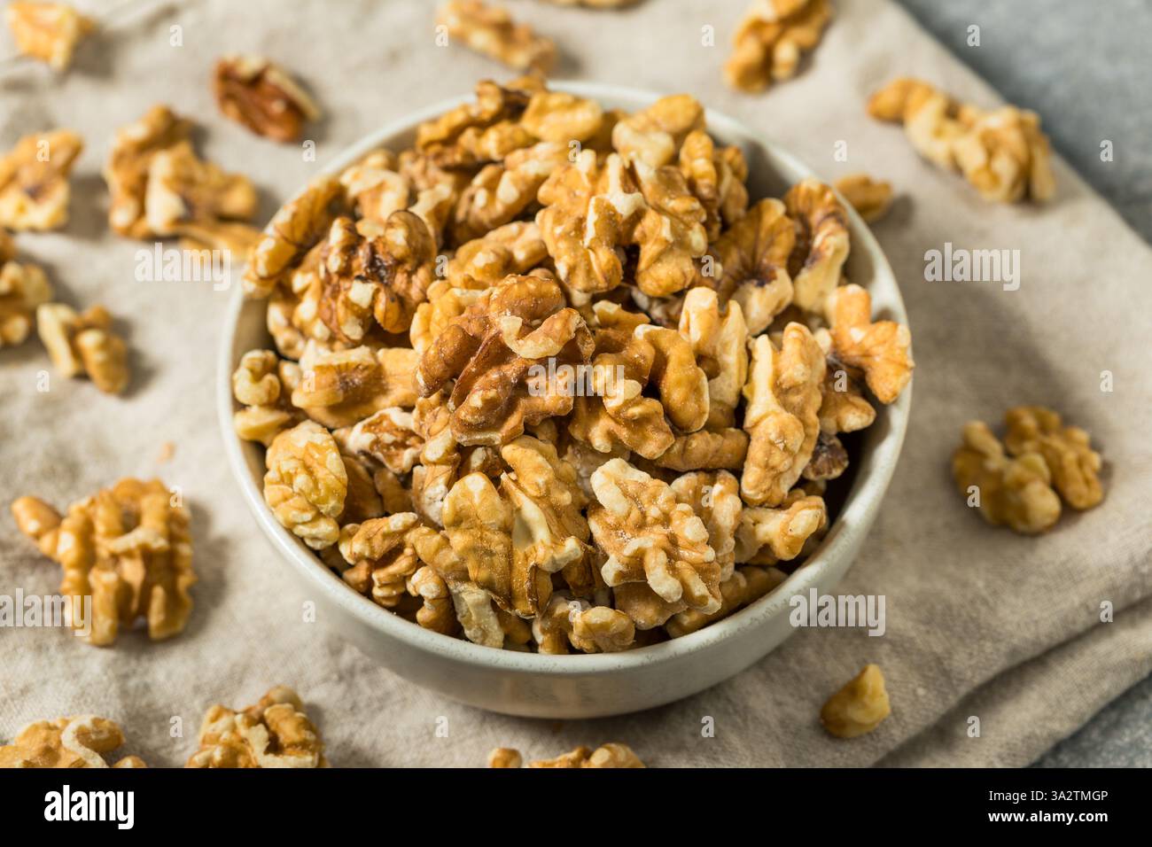 Organic Raw Walnut Halfs in a Bowl Stock Photo