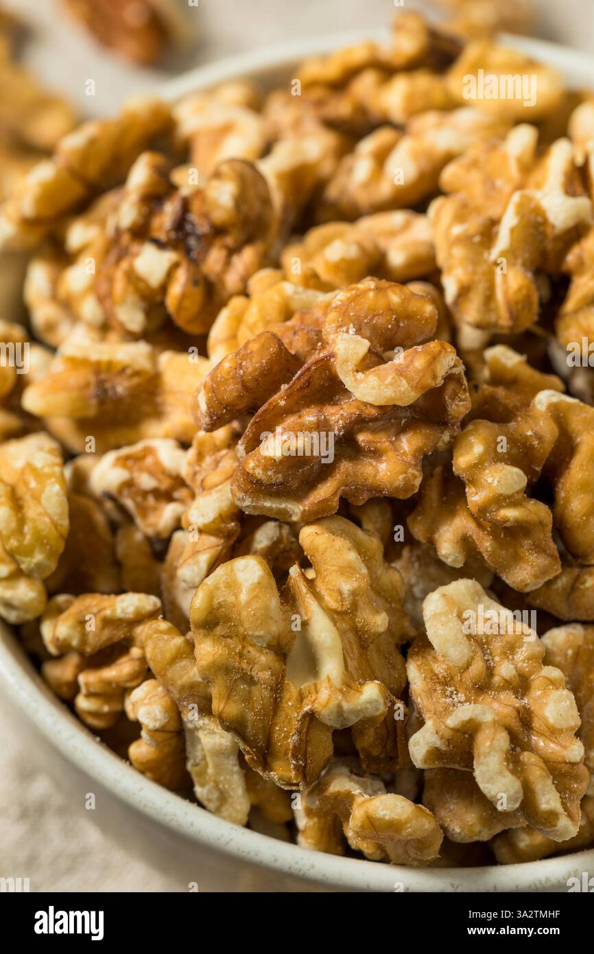 Organic Raw Walnut Halfs in a Bowl Stock Photo