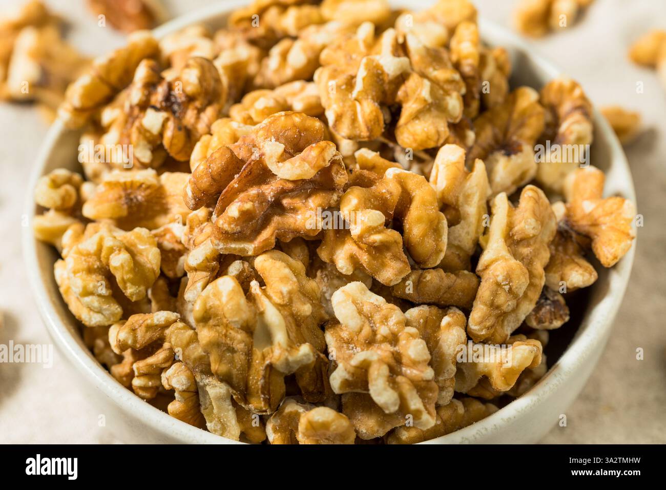 Organic Raw Walnut Halfs in a Bowl Stock Photo