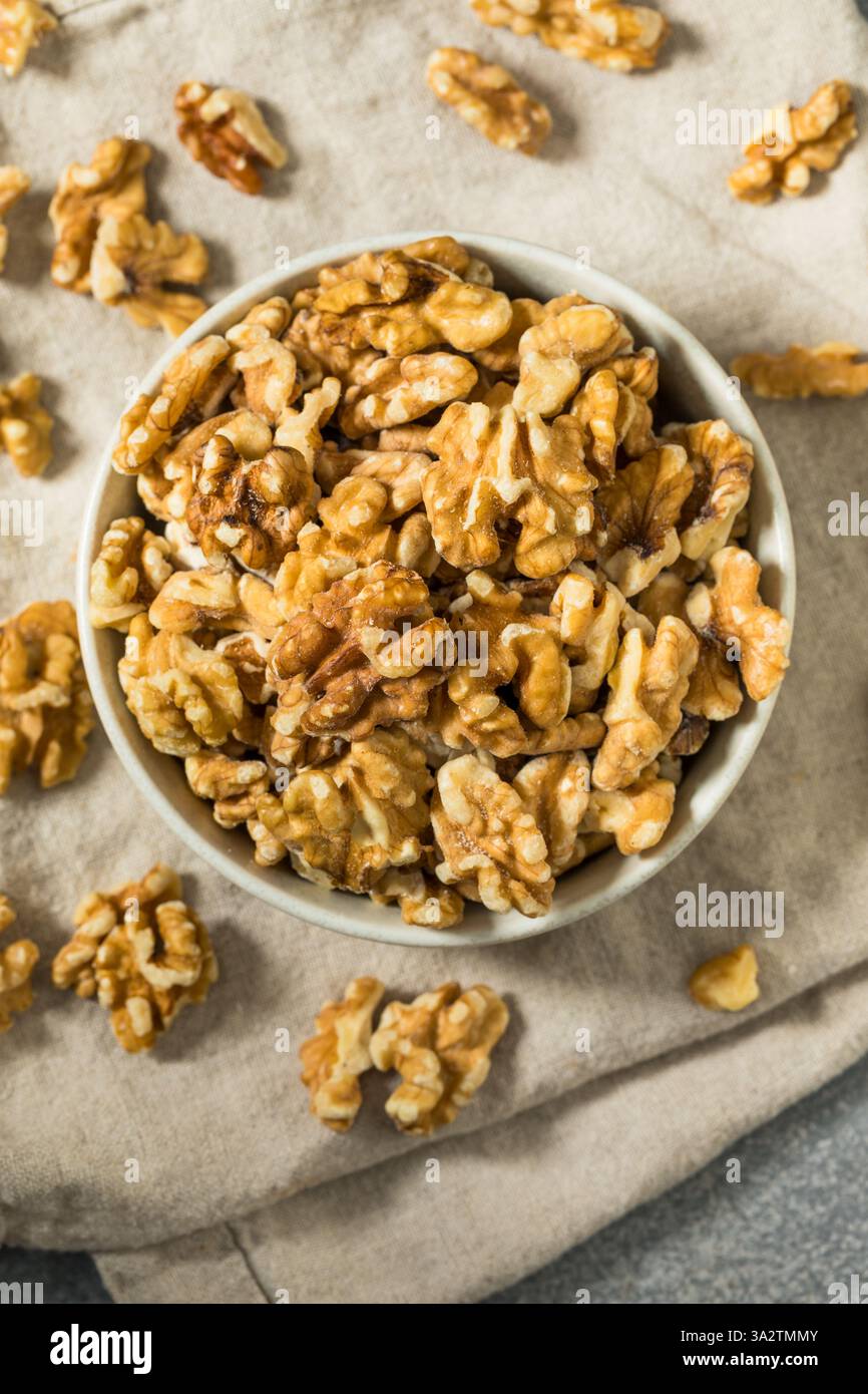 Organic Raw Walnut Halfs in a Bowl Stock Photo