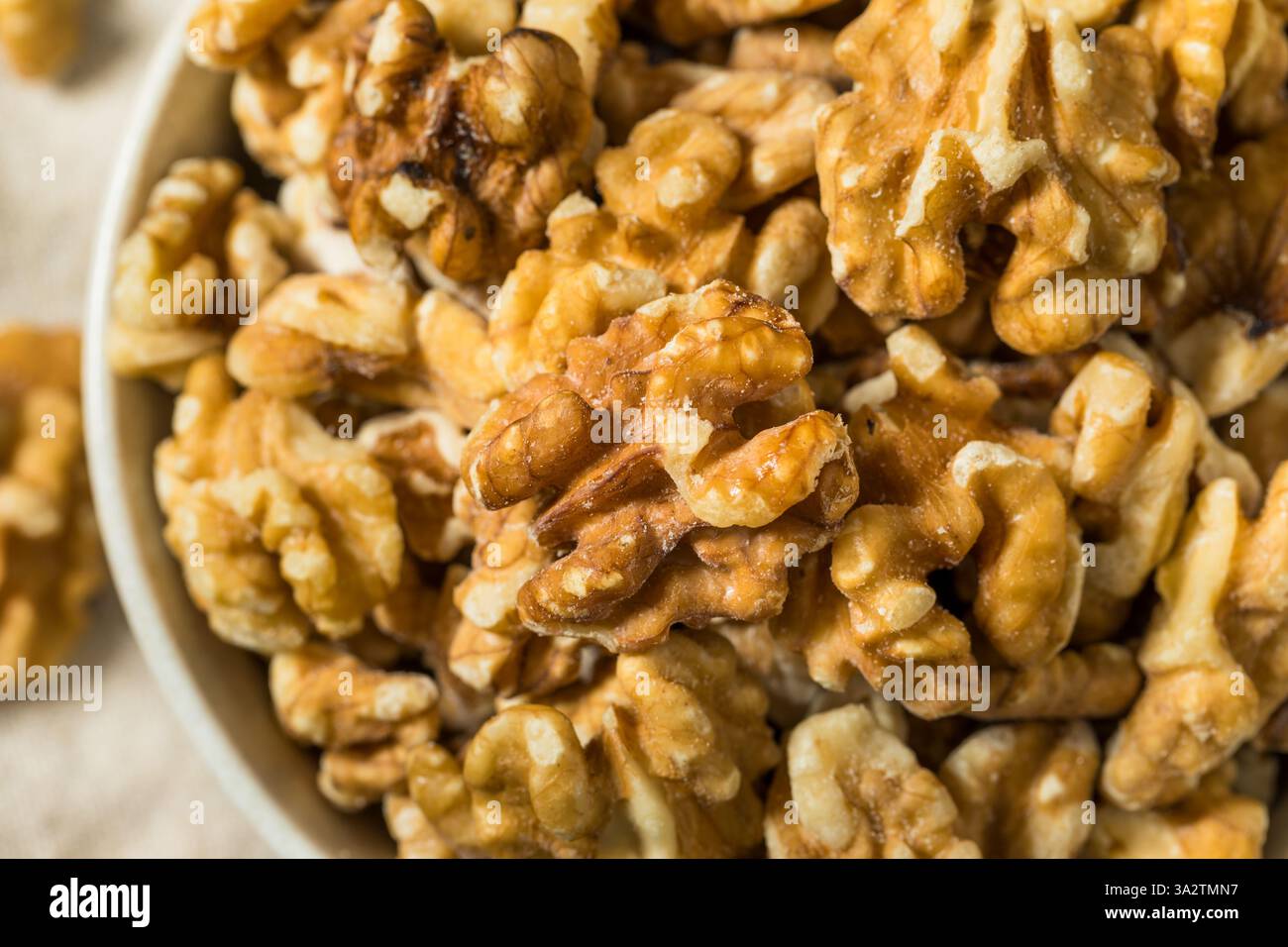 Organic Raw Walnut Halfs in a Bowl Stock Photo