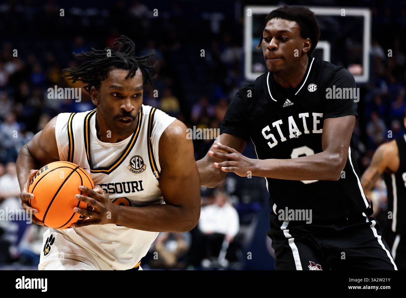 Missouri center Josh Gray (33) drives against Mississippi State forward ...