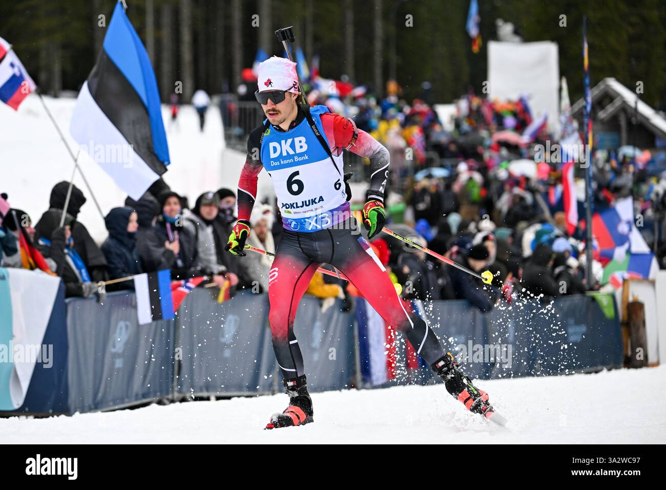 Pokljuka, Slovenia. 13th Mar, 2025. Adam Runnalls of Canada seen in action during the Men's 15 km Short Individual Competition of the IBU Biathlon World Cup. Credit: SOPA Images Limited/Alamy Live News Stock Photo
