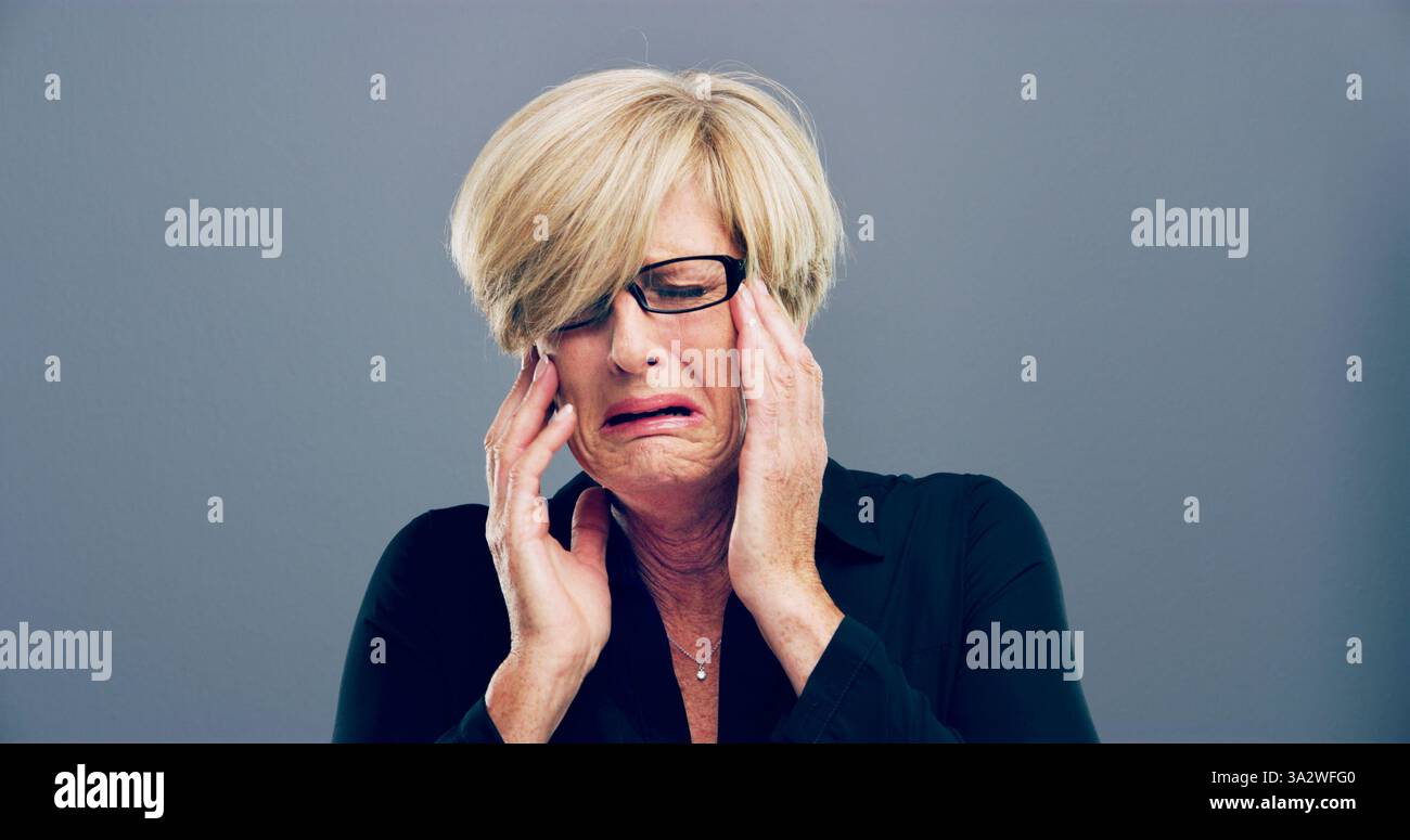Lonely, mature woman and crying in studio for depression, mourning loss ...