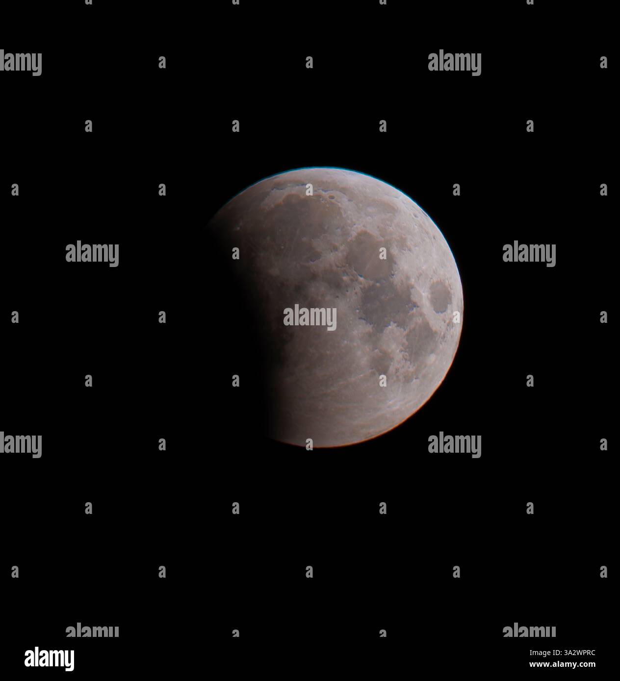 London, UK. 14th Mar, 2025. The partial lunar eclipse in progress ...
