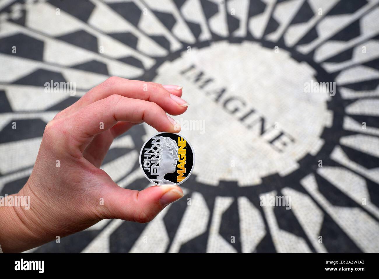 EDITORIAL USE ONLY A collectable coin featuring John Lennon and the ...