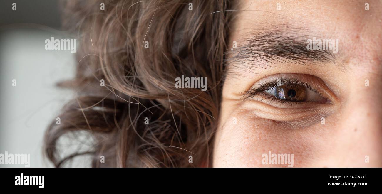 Curly brown hair brown eye hi-res stock photography and images - Alamy