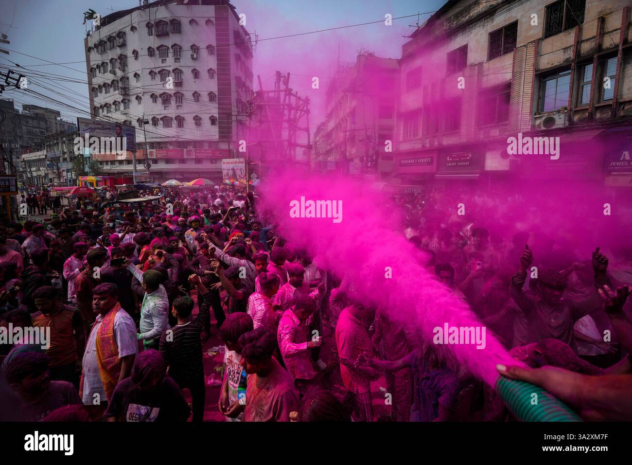 Indians dance as they celebrate Holi in Guwahati, India, Friday, March