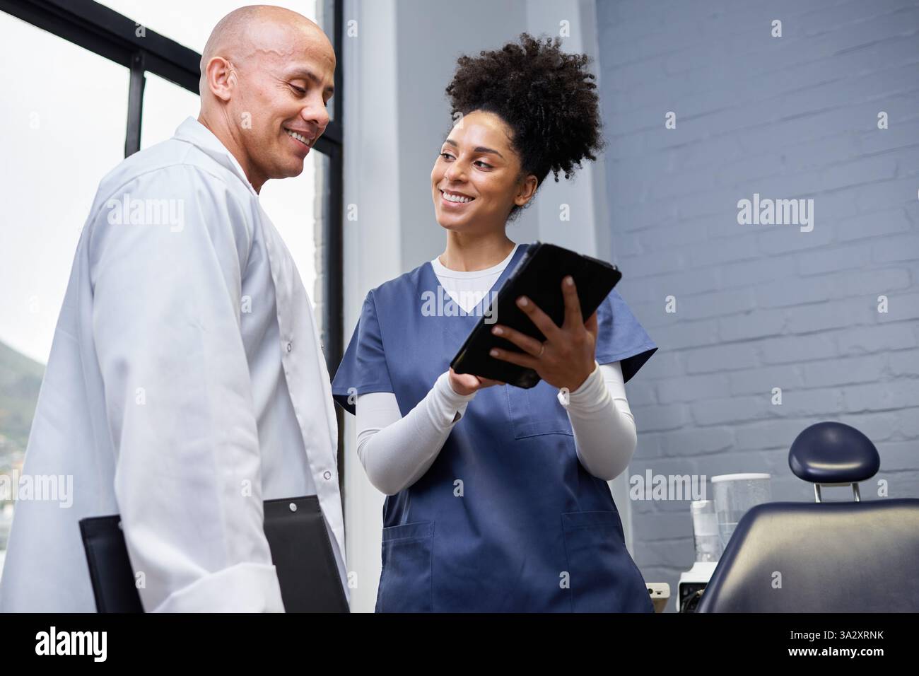 Smiling Team Collaboration of Healthcare Professionals in a Modern Office Setting Stock Photo