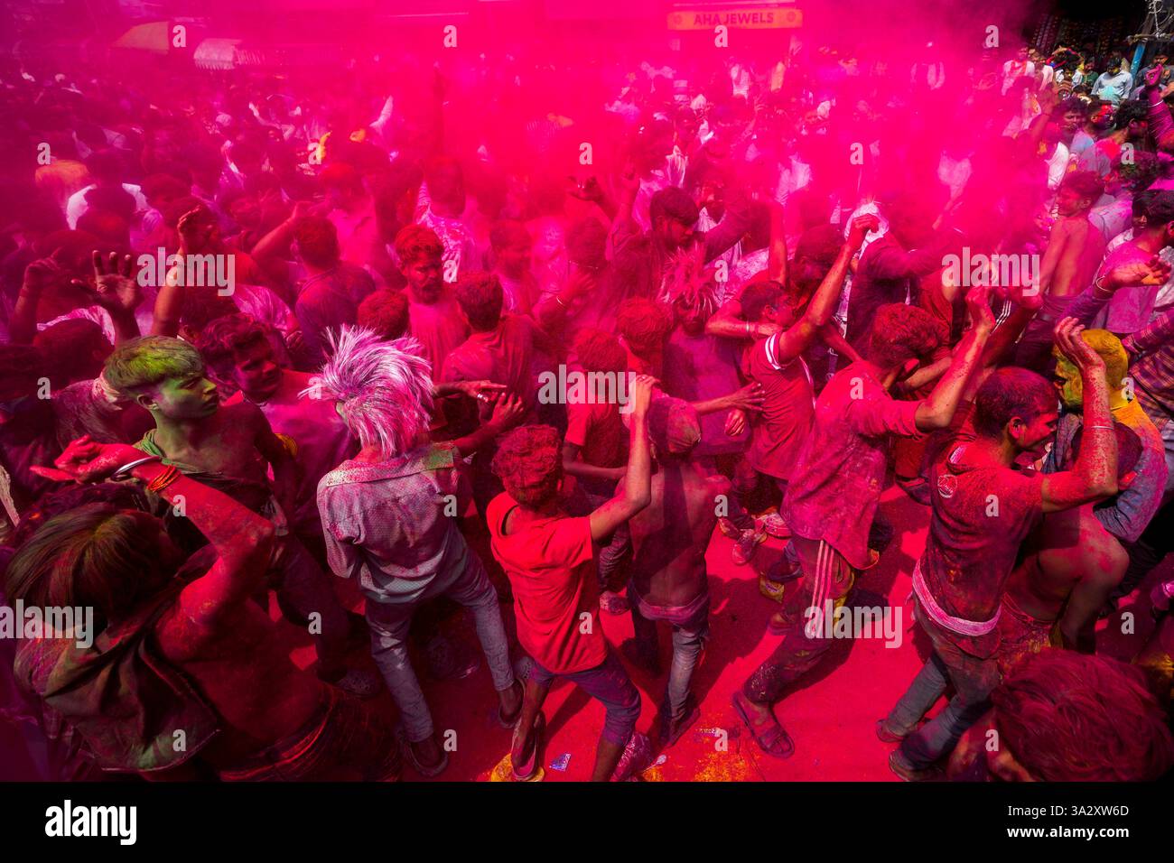 Indians dance as they celebrate Holi in Guwahati, India, Friday, March