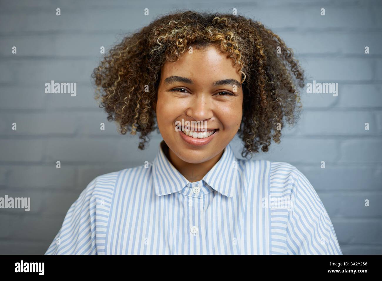 Portrait woman in striped shirt hi-res stock photography and images - Alamy