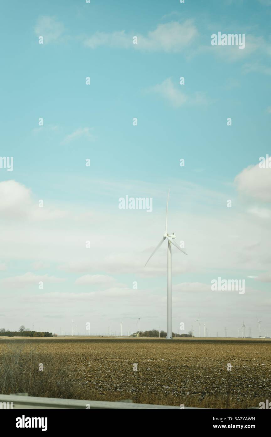 Wind turbine stands in an open Indiana field with copy space Stock Photo