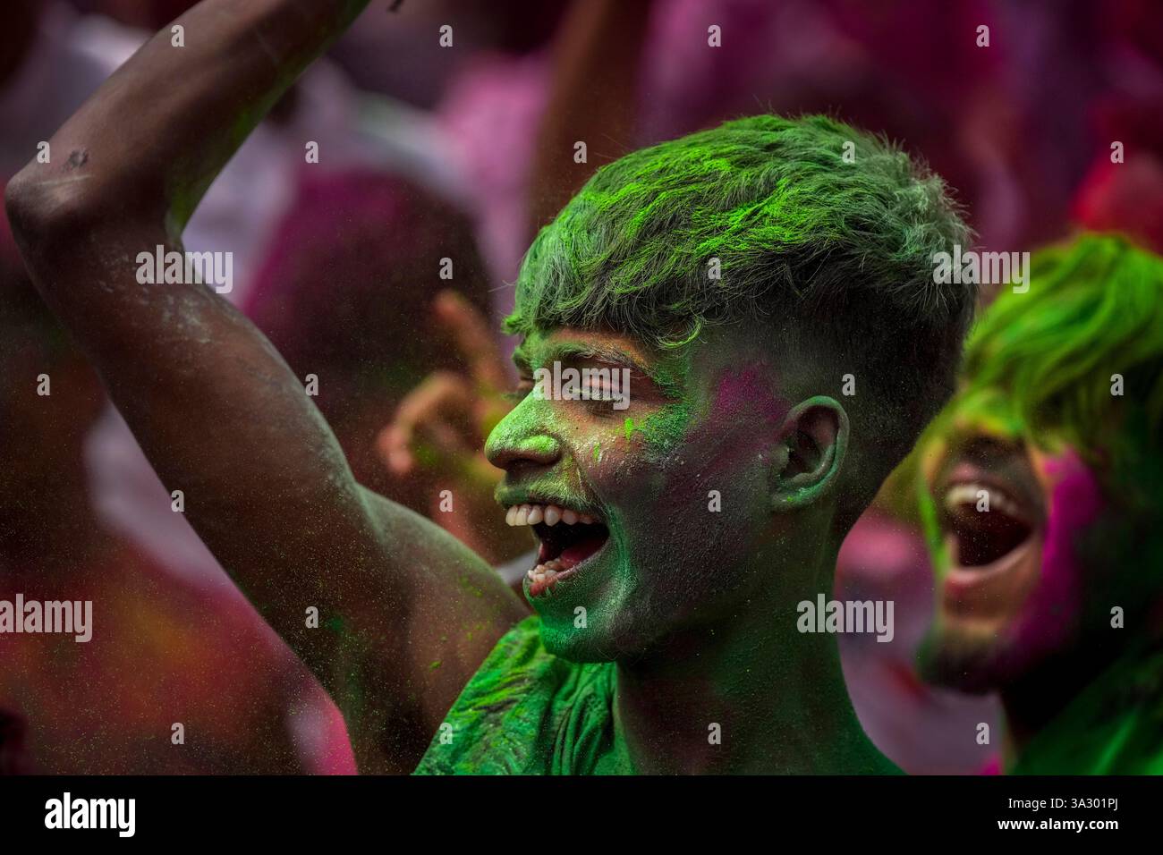 Indians dance as they celebrate Holi in Guwahati, India, Friday, March