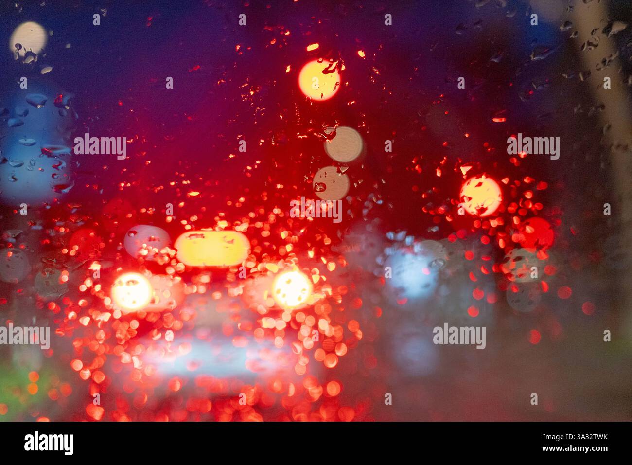 Rainy Night Traffic Through a Wet Windshield View Stock Photo - Alamy