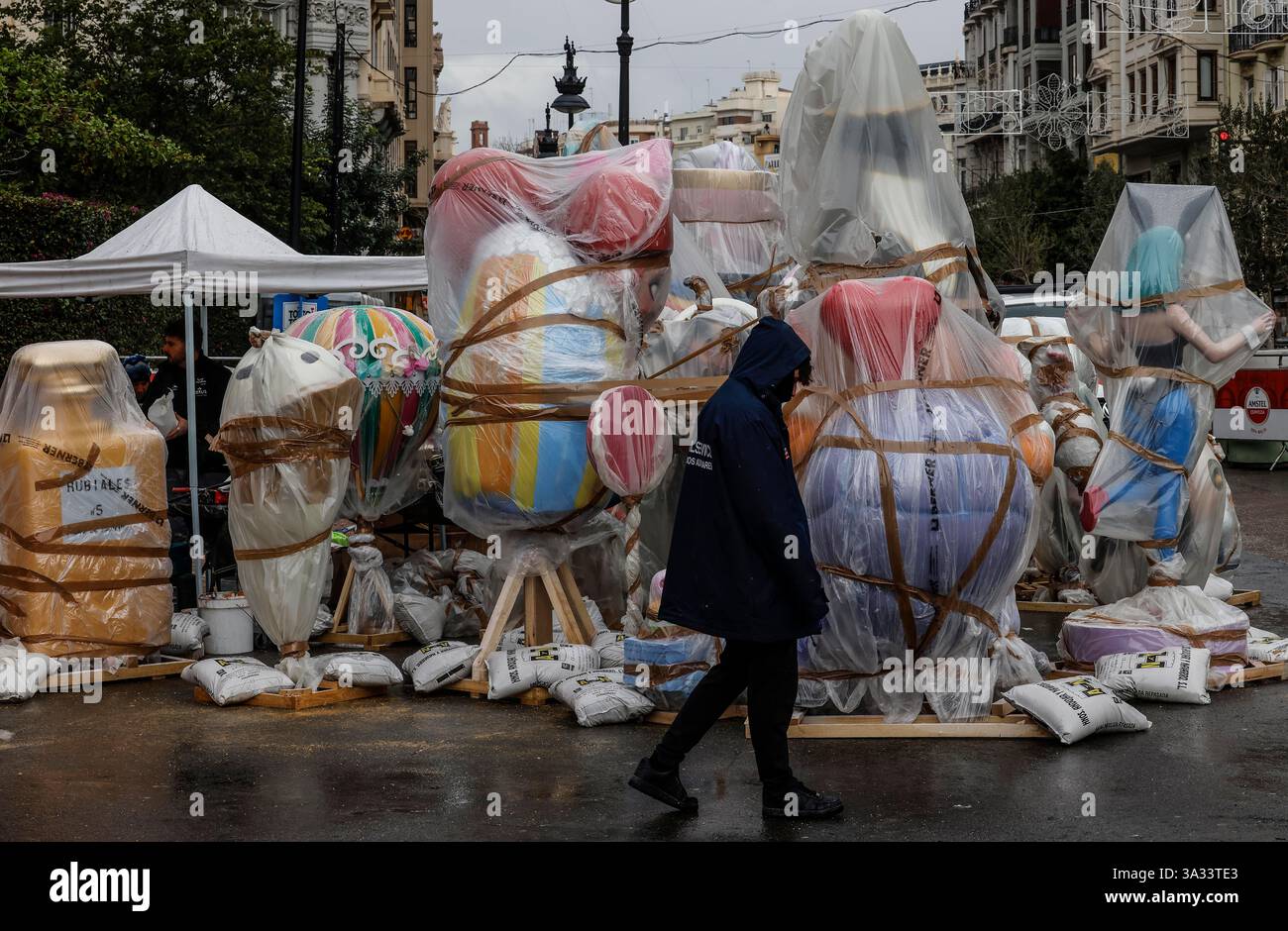 Several ninots covered with plastics because of the rain, on March 14 ...
