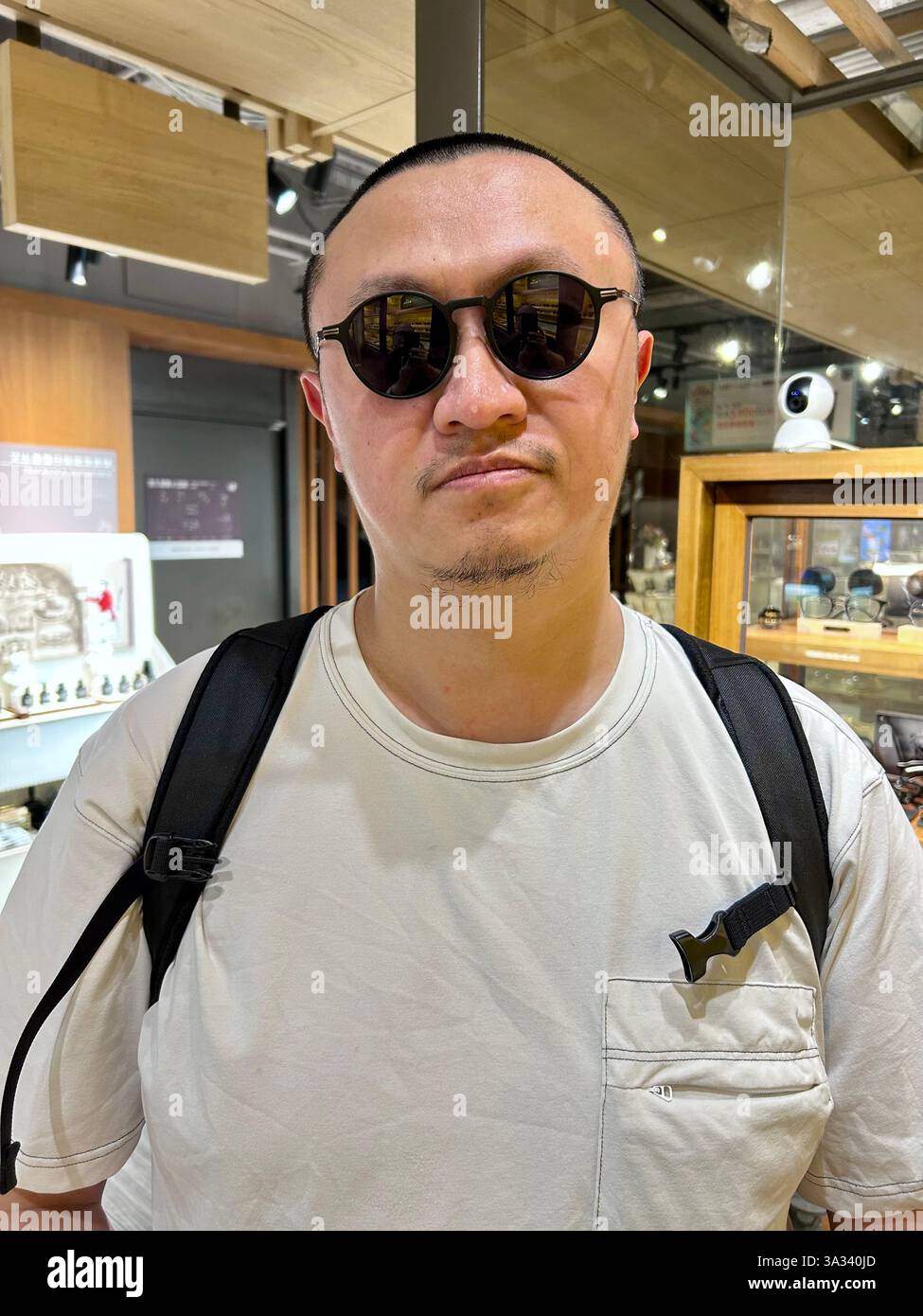 Taipei, Taiwan, Portrait, Man with Sunglasses, Chinese Tourist, inside, in Local Taiwanese Hot Pot Restaurant, 'Chin Huajiao' - Smartphone Captured Stock Image
