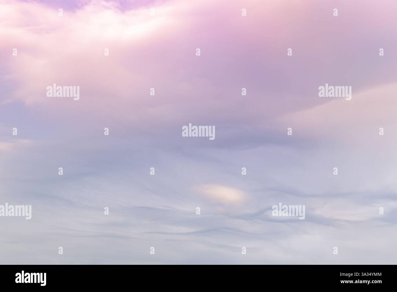 A serene sky with soft pastel shades of pink and blue, featuring gentle ...