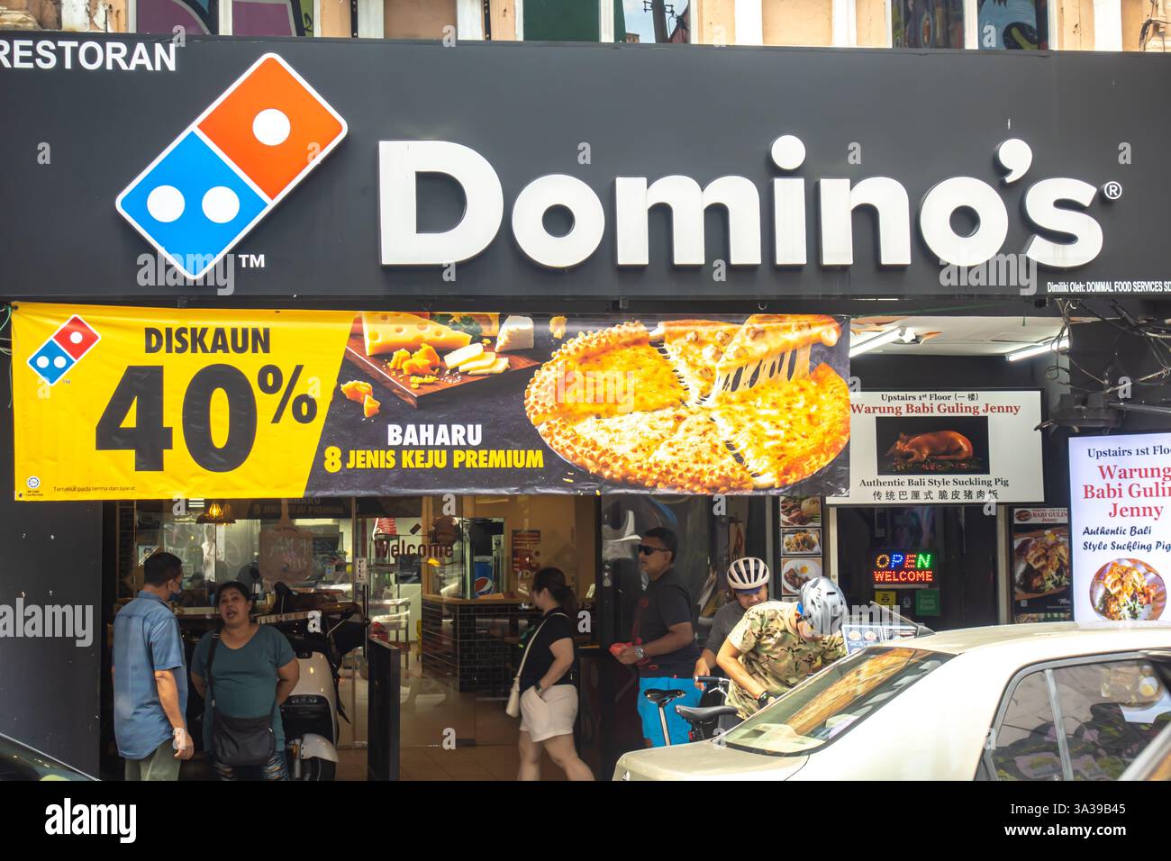 Domino's Pizza restaurant storefront, featuring a large sign with the company logo, Kuala Lumpur, Malaysia, Asia Stock Photo