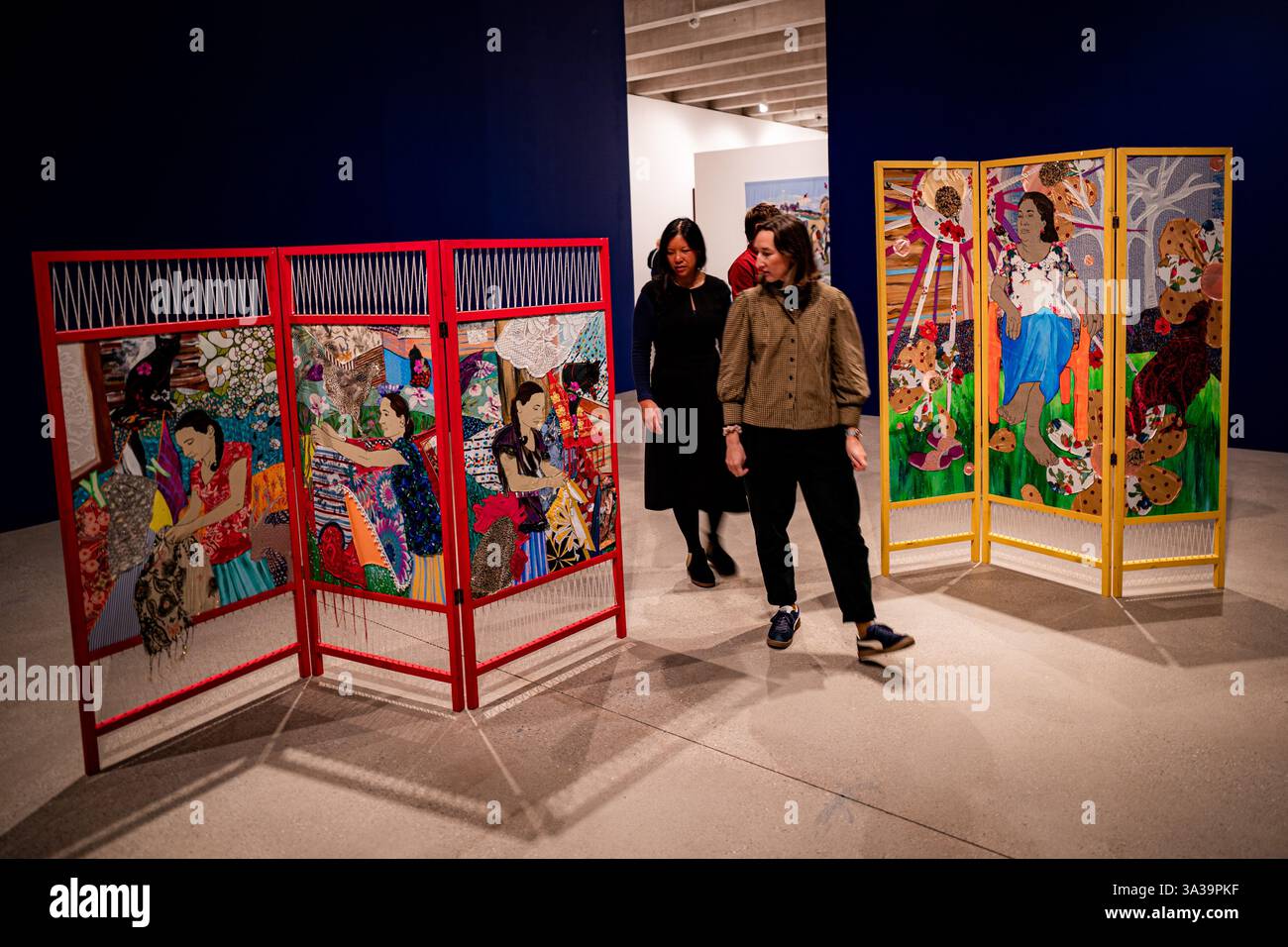 People admire artworks titled Communities during the first major UK ...