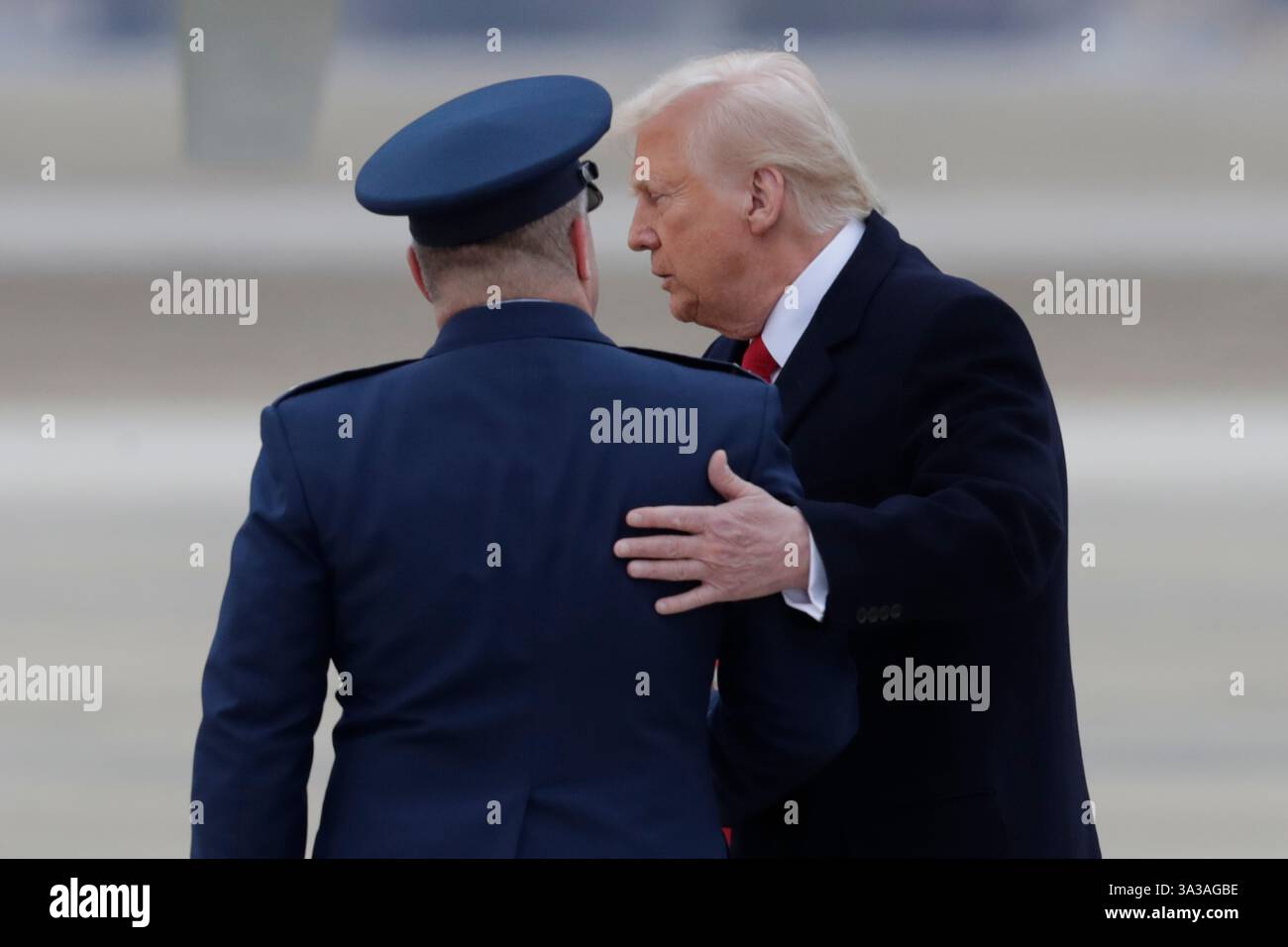 President Donald Trump speaks with Col. Paul Pawluk, Vice Commander of the 89th Airlift Wing