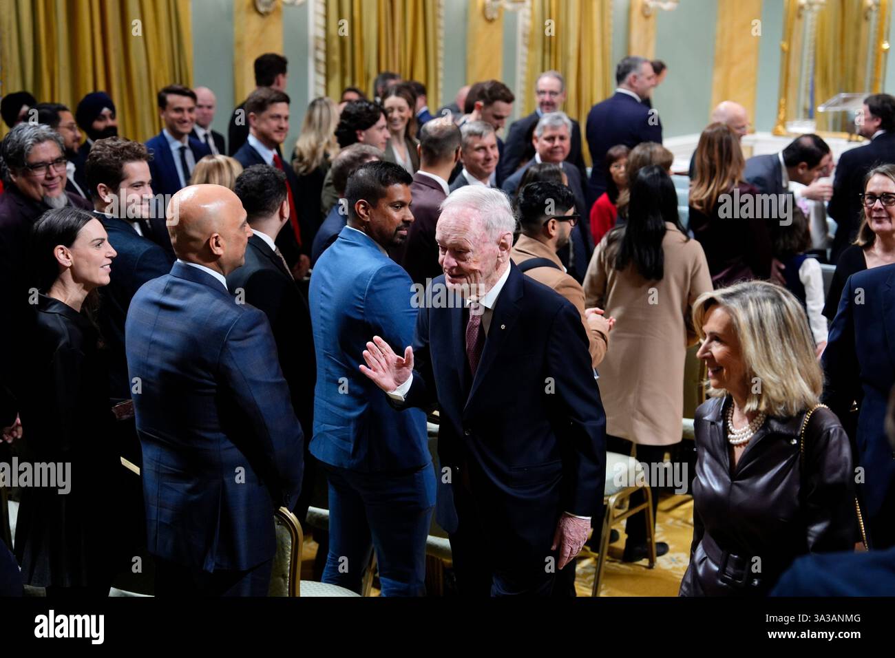 Former prime minister Jean Chretien waves as he leaves a cabinet ...