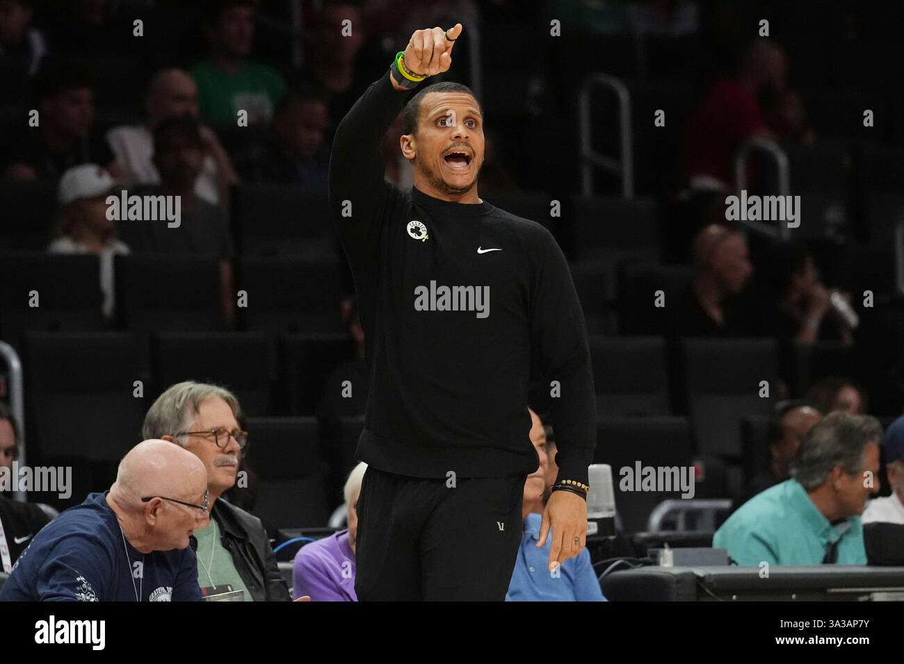 Boston Celtics head coach Joe Mazzulla gestures during the first half of an NBA basketball game