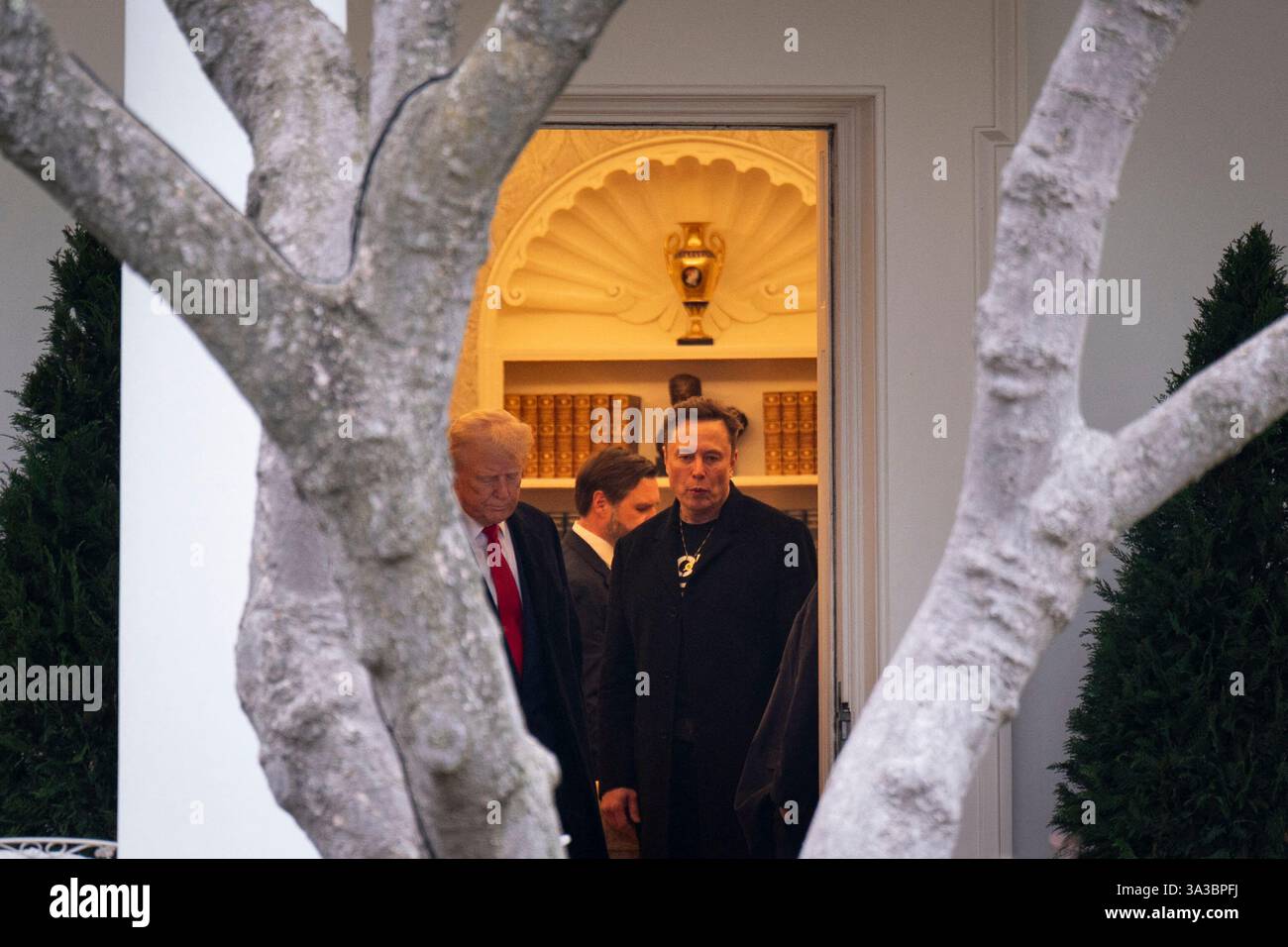 US President Donald Trump walks out of the Oval Office of the White ...