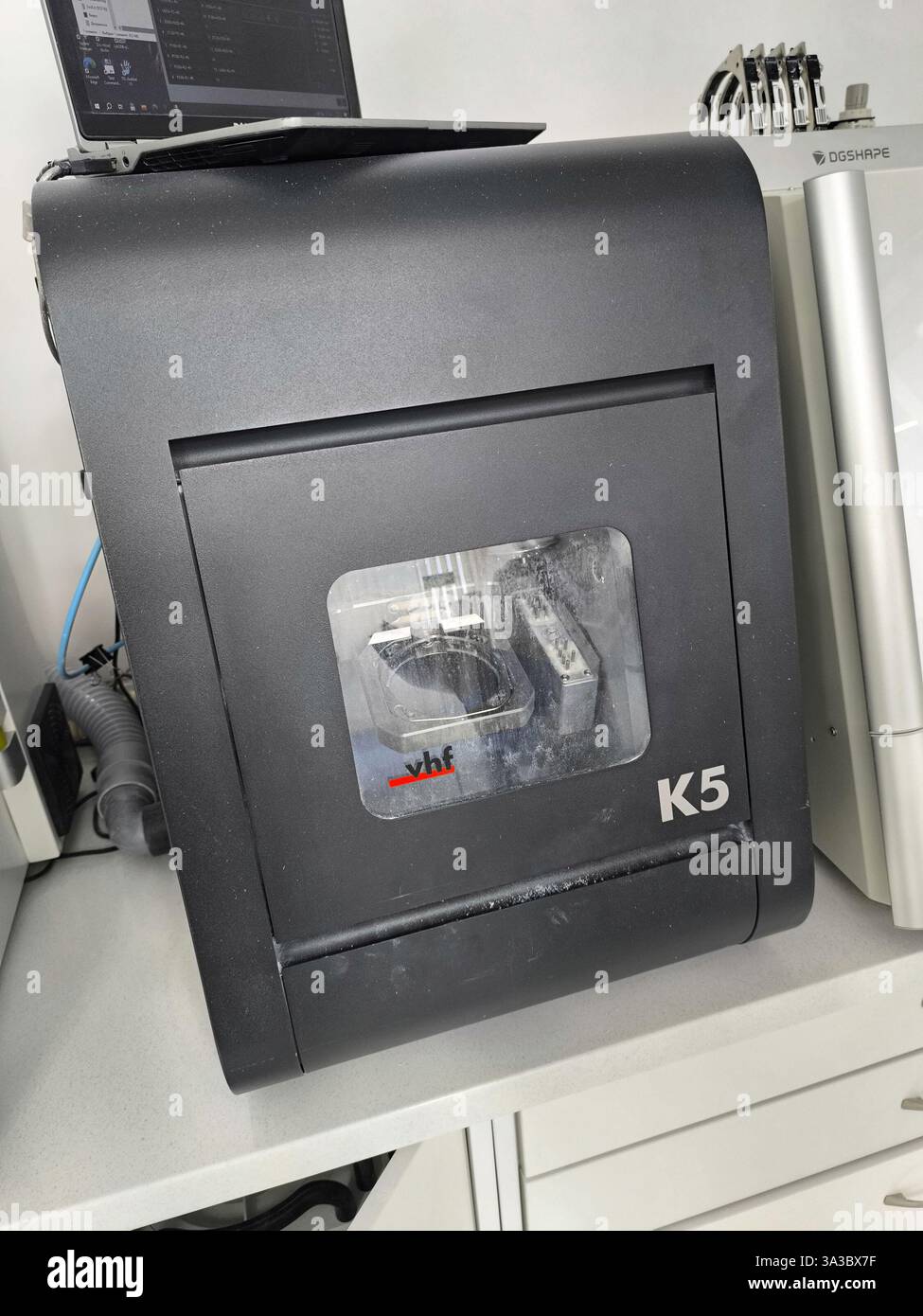K5 dental milling machine in laboratory for precise denture fabrication. Stock Photo