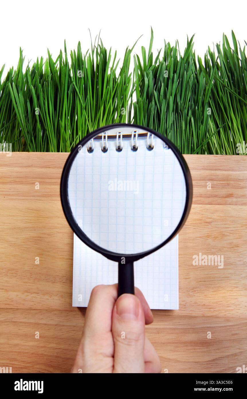 Loupe on the Notepad Isolated on the White Background Stock Photo - Alamy