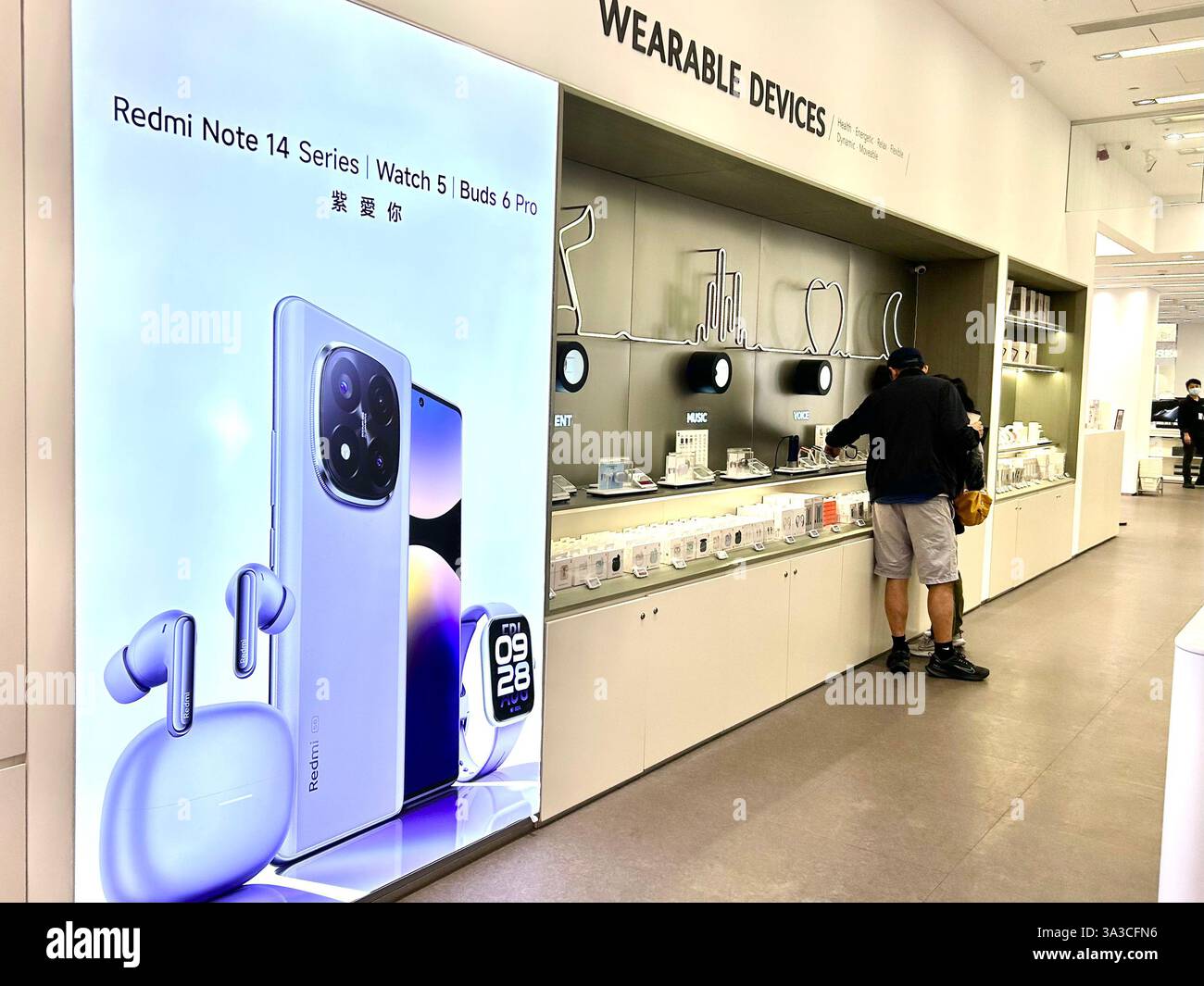 Taipei, Taiwan, Young People Shopping inside, XIAOMI Smart Phone Store, in Taipei 1 Shopping Center, Chinese Technology Showroom - Smartphone Captured Stock Image